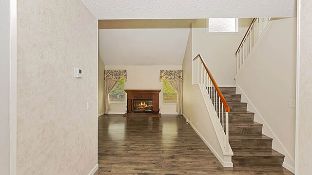 Living Room with Fireplace - Staircase to 2nd Floor