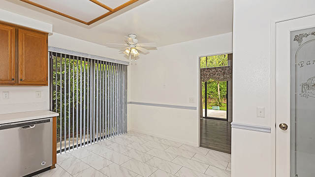 Kitchen Access to Side Yard & Dining Area