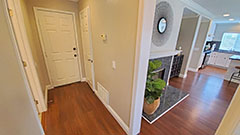 First Floor Hallway to Full Bathroom, Storage Closet, & Garage Access