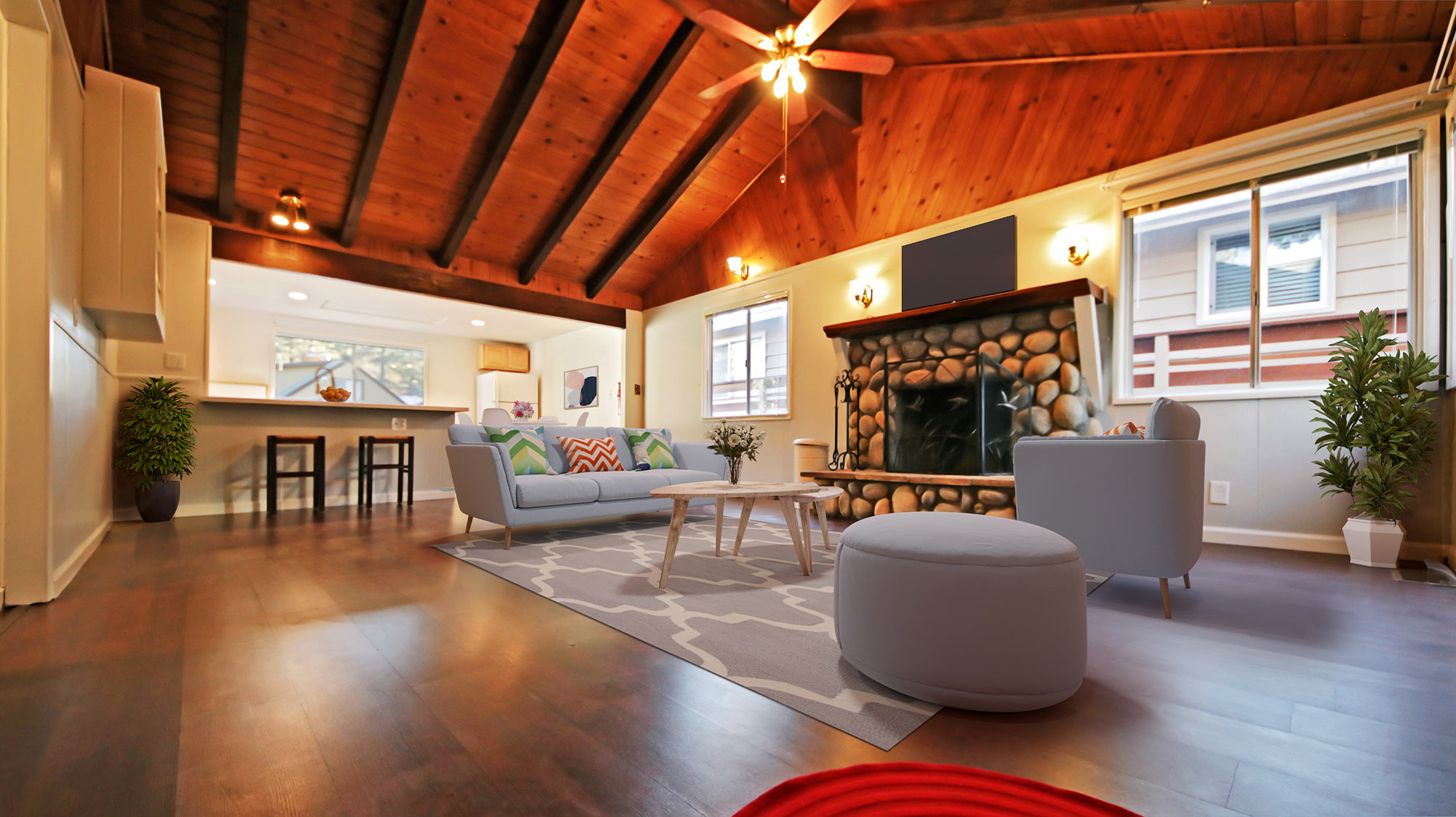 Living Room with Stone Fireplace & High Vaulted Beam Ceiling